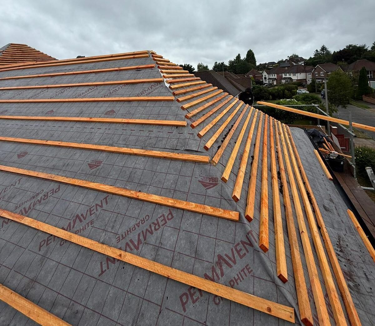 Close-up of roof ridge and tile repair in Bromley by A1 All Weather Property Solutions.